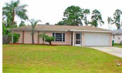 Port Charlotte -- Three bedrooms and two baths with 1334 sqft under air built in 1990 on 10,000 sqft of land. Combination living and dining rooms with cathedral ceiling. Split bedroom plan. Large screened lanai overlooks the fully privacy fenced rear y