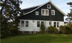 With rural-area serenity. Happy 4-bedroom Traditional-style. This enviable 1-1/2 story highlights formal dining room, hardwood flooring. Private den, main-level laundry, central air. Two-car garage, basement, deck. Covered porch, storage shed, well water.