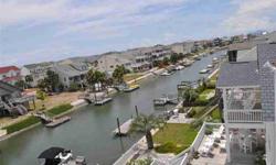 Delightful 4 bed 4 bath deep water canal home, thoughtfully renovated in 2006.The kitchen has granite counters, white beadboard cabinets w/nickel hardware, a large work island/ breakfast bar, Maytag appliances, bay window and recessed lighting. An open