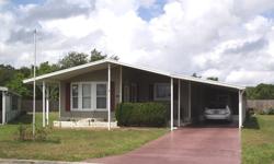 Great location, great price, and great home! What more could you ask for? This beautiful double-wide mobile home is located in South Hill. One of Zephyrhills more popular mobile home parks where you own the land under the home. No lot rent here! And since