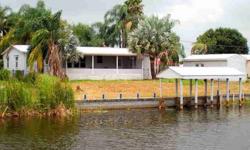 Lake Access, spacious 2 bedroom, 2 bath Double Wide manufactured home in Treasure Isle. This home has over 1550 sq. ft. under a/c and huge living room and kitchen. Both bedrooms are oversized with large baths and spacious closets. Master has soaking tub