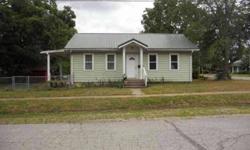 Nice home with two bedrooms plus an additional small room that could be used for an office or additional bedroom. Hardwood flooring. Nice corner lot with approximately one half chain link fenced. Very cozy and comfortable home. Check this property