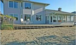 The Beach Party house! Walk out French doors to sand, fun, endless views! 2868 sq ft home on 71 ft of waterfront and miles of sandy beaches. Features open floor plan, 3 bedrooms, 2.5 baths, sauna, sun room, game room, master suite w/jetted tub, walk-in