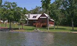 Built in 2007, this quintessential lake house is the picture of rustic elegance. You'll fall in love with the wide lank wood floors, paneled ceilings, covered porches, and big open view of Lake Wylie. Kitchen open to great room. Master and guest room on