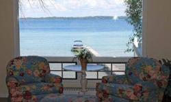 Beautifully updated home on generous direct bayfront property, located in peaceful area convenient to downtown Traverse City. This home is in move in condition and includes the dock! Tough to find such a livable spot and home on the bay for this price!