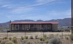 NICE LOCATION NORTH OF KINGMAN HAS OWN WELL, NICE MOBILE HOME WITH DETACHED GARAGE SPACE, FENCED YARD, FULL FRONT PORCH, PARTIAL BACK PORCH, ADDITIONAL ATTACHED GUEST ROOM IN PROGRESS.
Listing originally posted at http