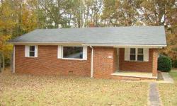 Eligible for USDA financing! Nice brick ranch, large covered front porch, hardwood floors in living room and bedrooms. Large kitchen with dining area, refrigerator, range, lots of cabinets. New interior paint, replacement windows, roof 8 years old,