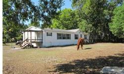 Short Sale; Sold in As-Is condition. Spacious 1.14 Acre; the horse stall was formerly a carport. 2 friendly Horses, "Tommy and Cash; friendly dog "Baxter" is inside. See Sign on fence and drive to "rear" property very private and a good location to many a
