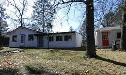 Two homes on a Village lot in Solon Springs. Used as rental property. The main home has 2 bedrooms, mud room/laundry, large kitchen and living area and a small family room or den with patio doors to the deck. Attached garage. The 2nd home has bath,