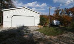.65 acre Double Lot on private Cul-de-Sac with 24 x 24 garage for all toys, 200 amp electrical services, with 100 amp to shower shed complete with full shower, stackable elec washer/dryer & 40 gallon hot water heater. Camper pad is gravel with 12 x 20