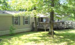 Terrific value! Immaculate three bedroom, two bath manufactured home nestled on a 2.79 acre lot. This open concept/split bedroom design features oak cabinetry, kitchen with snack bar and appliances, private master bath with garden tub/shower and walk-in