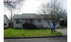 Best Buy in Woodburn Senior Estates! Great condition and move in ready! Kitchen beautifully updated cabinets, counter tops, stove, dishwasher, paint, flooring and more. Wood floors in living,Dining room and bedrooms. Large, private back yard with fruit