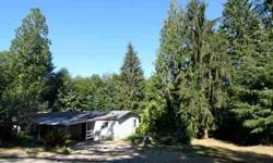 Park like 4.5 secluded acres within walking distance to Grapeview school. Older 3 bdrm manufactured home can be made liveable. Great building site. Live in mobile and build your new home! Large pump/storage building. Great rental or have your own private
