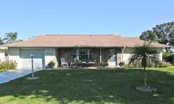 New on the market is this spacious two bedroom, two bath with very large family room, oversized two car garage, central water with well for sprinklers, fenced yard with fruit trees. Sit on the covered front porch or relax in the roomy screened porch with