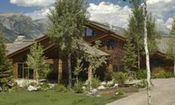 Majestic is one of the many words that come to mind as the aspen-lined driveway winds down to this magnificent home framed by snowcapped Teton Mountain views. The estate is nestled at the base of a forested hillside adjacent to open ranch 20 secluded