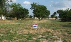 Great location, near the center of town. Close to shopping, schools, church etc. This lot has a very nice lay to it and offers a few beautiful trees. Restrictions include 'NO MOBILE HOMES'. Water and electric available to the property. Seller is moti
