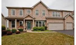 A FULL WALL OF WINDOWS WELCOME YOU IN! This stunner has an open floor plan with two story living and family rooms. Hardwoods, granite and stainless kitchen with huge island and breakfast bar. Full mstr ste with sitting room, two walk in closets and mstr