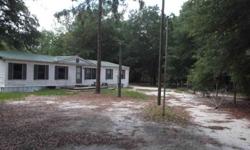 Take a look at the potential in this private, wooded, fenced 5 acre corner lot with a 3/2 1620 SQ FT mobile home. Property is heavily wooded in planted pines and other local hardwoods, and features a nice barn with concrete floor and a separate covered