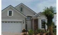 This beautiful home in the Lakewood Ranch Country Club won't last long. A three bedroom maintenance-free home with a den that can easily be converted into a third bedroom. An open kitchen plan with eat-in space and Corian countertops. The heated community