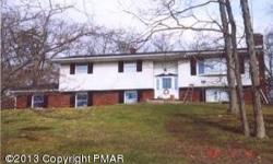 BUSHKILL 3BR 2 Full Bath Bi-Level. Living Room with Brick Fireplace, Eat-In Kitchen, Formal Dining Room w/ Sliders to 3 Seasons Sun Room, Large Lower Level Family Room w/ Stone Fireplace, Small Office. 2-Car Garage, 3 Zone Oil Heat, 2+ Acres! Needs Work.