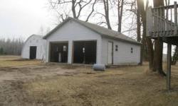 5 Br house with single attached garage, double detached garage & large Quonset.Listing originally posted at http
