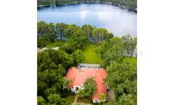 "Short Sale" Location! Location! Location! Nestled on a ski lake under large oaks, sits this beautifully designed, Hanna Bartelleto, custom built contemporary Florida lake home. This lovely piece of paradise features a wrought iron gated entry, fishing