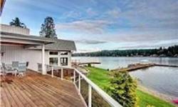 Stunning Lake Goodwin Estate! Sweeping lake views. No expense spared on major addition in 2002! Dramatic foyer, formal dining room encircled by display cases & columns. Warm oak flooring w/cherry inlays. Great room has it all-fireplace, 2nd kit/bar,