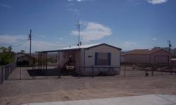 Well Maintianed 2 bedroom 2 bath manufactured home. Fully fenced 85X136 lot with 2 carports, storage shed, 2 large gates for easy boat and RV access. Covered patio, open living area, plenty of room for all the lake toys. Clean turn key property bring your