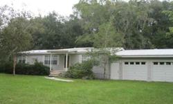 Long County. Mobile home features living room with fireplace. Dining room, kitchen. 3Br 2Ba. Split bedroom floor plan. Sunroom. 2 car garage with bathroom. Fenced rear yard. 2 storage buildings.Listing originally posted at http