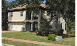 SHORT SALE One of a kind, Mediterranean style custom home built by Florida Looks in the desirable gated community of Lakes of DeLand . View of private lake off the two open front porches, one upstairs, one down. Two over sized screened porches on the rear
