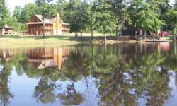 LARGE LOG HOME ON 22+ ACRES WITH 2 THREE ACRE LAKES I 2 OUT BUILDINGS, AN A-FRAME, DOCK ON 1 LAKE, GAZEBO 700-800 FEET ON JOHNS CREEK, LAKES ARE LOADED WITH FISHListing originally posted at http