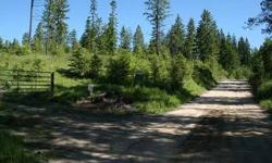 This fabulous secluded building site has southern exposure, open meadows, timber, wildlife, and views of surrounding mountains. Only 3 miles from paved road and approx. 40 minutes to Spokane and borders timber company lands. Abundant surface water keeps