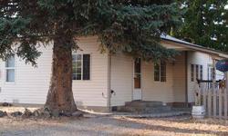Charming cottage for you to place your sweat equity into, or a great investment property. Close to the Yakima River and Cle Elum areas fun recreational opportunities. This home has a great big deck and fully fenced backyard with alley access. Laminate