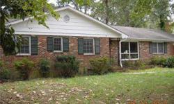 Cozy rancher. Three bedrooms, two bathrooms. Wood floors. Brick fireplace. Listing agent and office