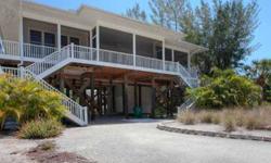 4 bedroom, 2 bath Key West home across the sandy road to beach access. Large living area inside & out. Offers community pool, tennis & dockage right behind home.