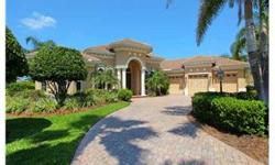 Elegant custom home. One of the most beautiful homes in Lakewood Ranch Country Club with extensive upgrades and a premium lake lot. Perfectly sized at 3600 square feet, this open and airy home offers 3 bedrooms plus a huge Bonus Room and 3 full en-suite