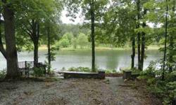 GATED LAKE FRONT PROPERTY WITH STONE SITTING WALL & WALKWAY, DECK, DOCK, UNDERGROUND UTILITIES, 2400 SQ. FT CLUBHOUSE, SWIMMING BEACH AREA, MILES OF WALKING TRAILS TO ENJOY, WILDLIFE GALORE, 150 ACRES COMMON AREA, STOCKED LAKE, SO SERENE!! CALL TODAY!