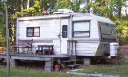 Beautiful wooded parcel with electric and well for camper hookup--No septic. 2 CAMPERS INCLUDED, 1 road ready. Also 2 storage buildings with electric. Just a terrific place to get away from the hustle and bustle of the city.Listing originally posted at