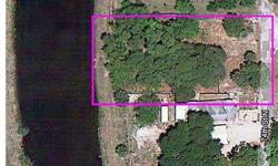 Waterfrontage on Joe's Creek, Vacant and Flat. All the work is done - small home removed to clean the homesite of your dreams. All utilities previously in place. You won't find cheaper waterfront land anywhere near by. Central location near Mall, resta