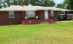 Charming brick well cared for Saluda bungalow with lots of character. A rocking chair front porch and large fenced back yard. The formal living room is large - family room can be a 3rd BR. Gorgeous hardwood floors some underneath carpet. Eat in kitchen