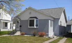City home with view of Manistique Lighthouse and Harbor. Well maintained, move-in ready - 2 bedroom, 1 1/2 bath home with full basement and extra large 30' x 40' insulated and heated garage. Updated kitchen and bath and newer roof. Natural gas heat and
