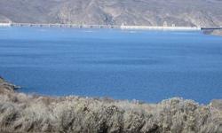 Beautiful extra large Lake Roosevelt view lot. Paved road and covenants to protect your investment. View the lights of Grand Coulee Dam from your home.Listing originally posted at http
