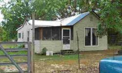 Bring ALL your family. This 5 ac. m/l has a 2 bedroom, 1 bath home and 2 mobile homes. Both mobiles have 2 bedrooms, 1 bath. This property is just a few miles out of town and has a private lane in to the homes.You don't see any other neighbors. There is a