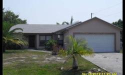 3 bedroom, 2 bath, 2 car garage in-ground pool home in East Port St Lucie. This home sits on a fenced in corner lot with a screened back patio overlooking the pool. Split bedroom plan for added privacy. Kitchen is open to dining room. Family room has