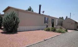 45+ Community. Well cared for single wide manufactured home. E-Z care landscaping and Storage Shed. Park your R.V. in yard. Deming Estates has restrictive covenants, homeowners volunteer 24 hour patrol, and club house with activities. HOA are $45.00 per