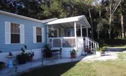 So inviting, starting with the covered front porch with concrete sidewalks all the way around, lots of landscaping. This 3/2 bath with a private entrance to 1 bedroom and bath mother in law suite, Nice and open floor plan, with wood burning fireplace.