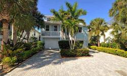 Siesta Key's Canal Home, only three blocks from the Nations #1 Beach! This custom build home is constructed to exceed current hurricane standards, it has high impact windows and shutters on all openings. Saltwater heated pool with cobblestone patio and