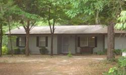 Concrete block home on 5 acres. Garage has been converted to be a family room,(12x24) which is not completely finished nor does it have AC. (336 sqft is not added into main home). This property is zoned RSF 2. Restrictions on no horses, cows, pigs, etc.