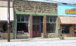 Come open a business in downtown Leslie in a building that is eligible for the Historical Register. At one time there was a second story in the back, but it was not structurally sound, so it was taken down. However, it could be reconstructed and living