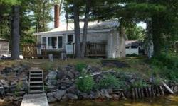 Charming Indian Lake waterfront cottage on 50' of sandy bottom frontage. Comfortable 3 season cottage with 1 bedroom that sleeps 4, 1 full bath, lakeside deck and dock. Appliances and most furnishings included. Indian Lake properties are selling this